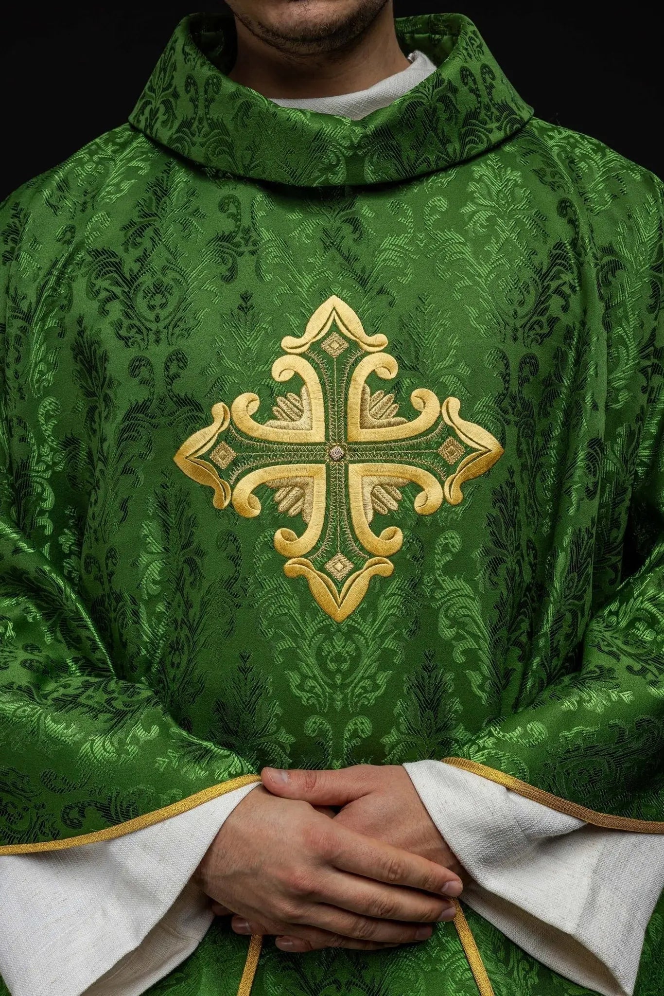 Green chasuble with cross sewn from patterned fabric