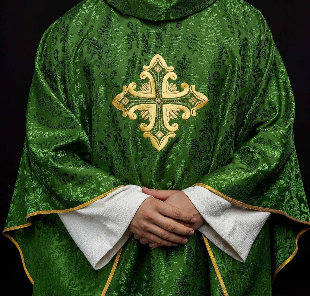 Green chasuble with cross sewn from patterned fabric