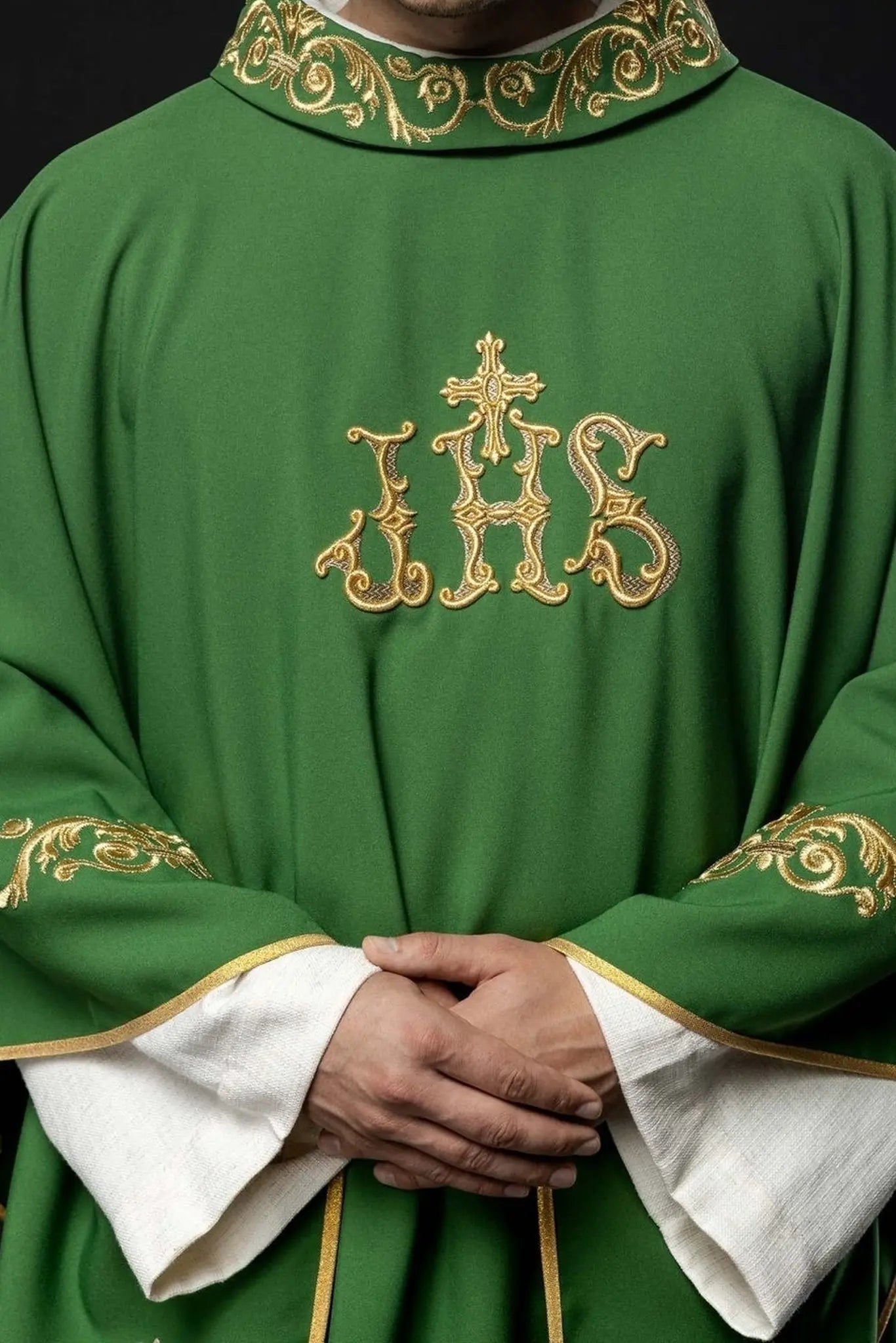 Green chasuble with gold IHS embroidery and decorative trim
